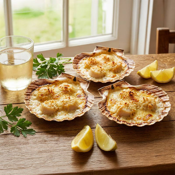 Recette de coquilles Saint-Jacques gratinées au vin blanc